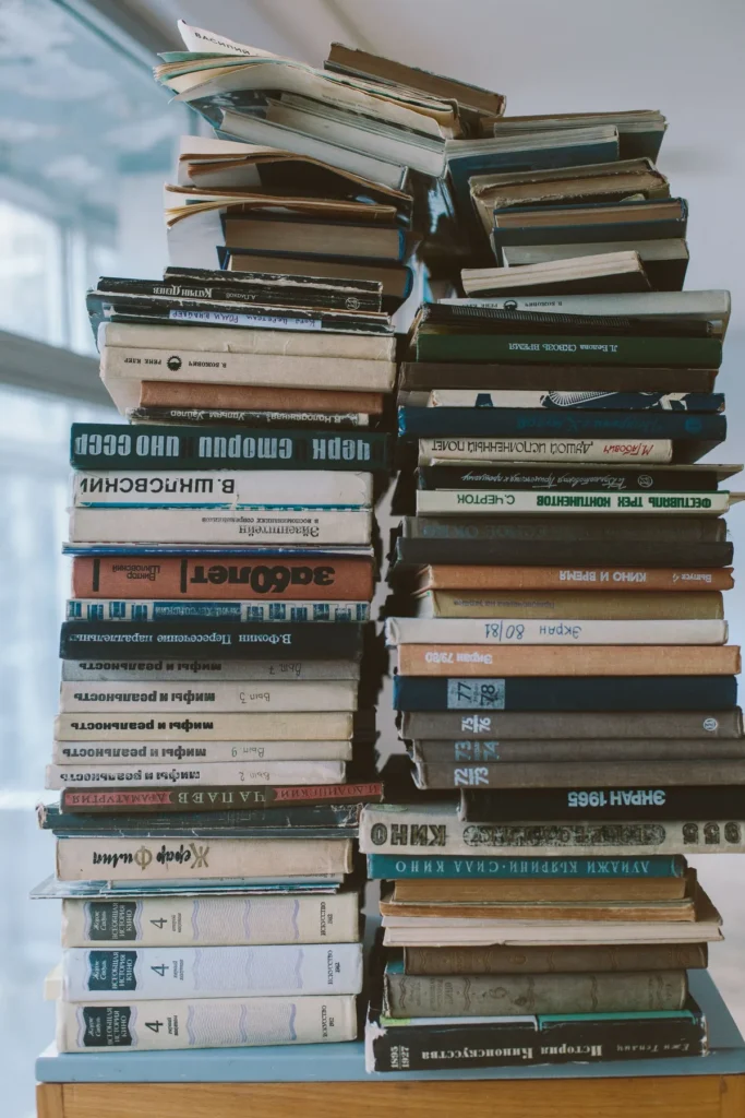 A tall, organised stack of professional reference books