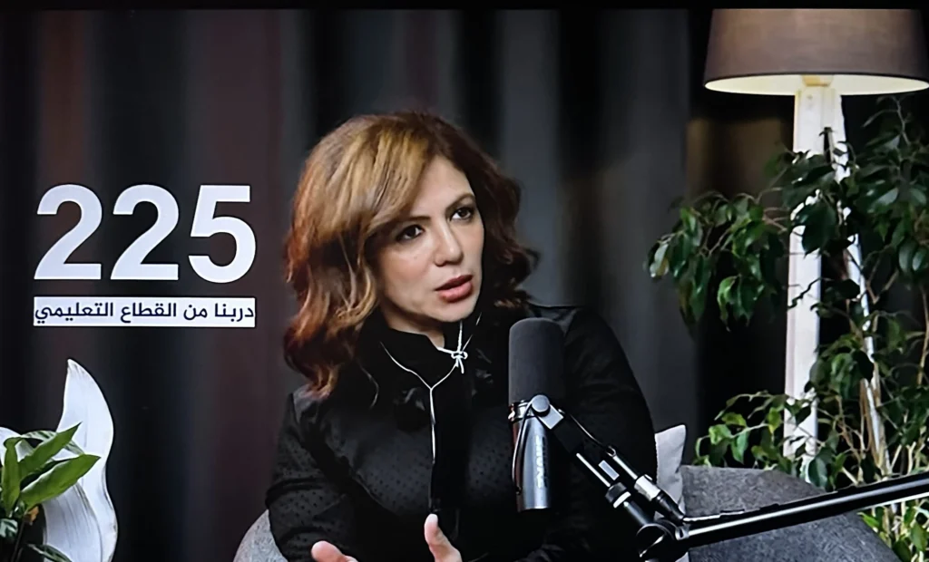 Dr. Mayada Elsabah being interviewed in a TV studio on TEN TV