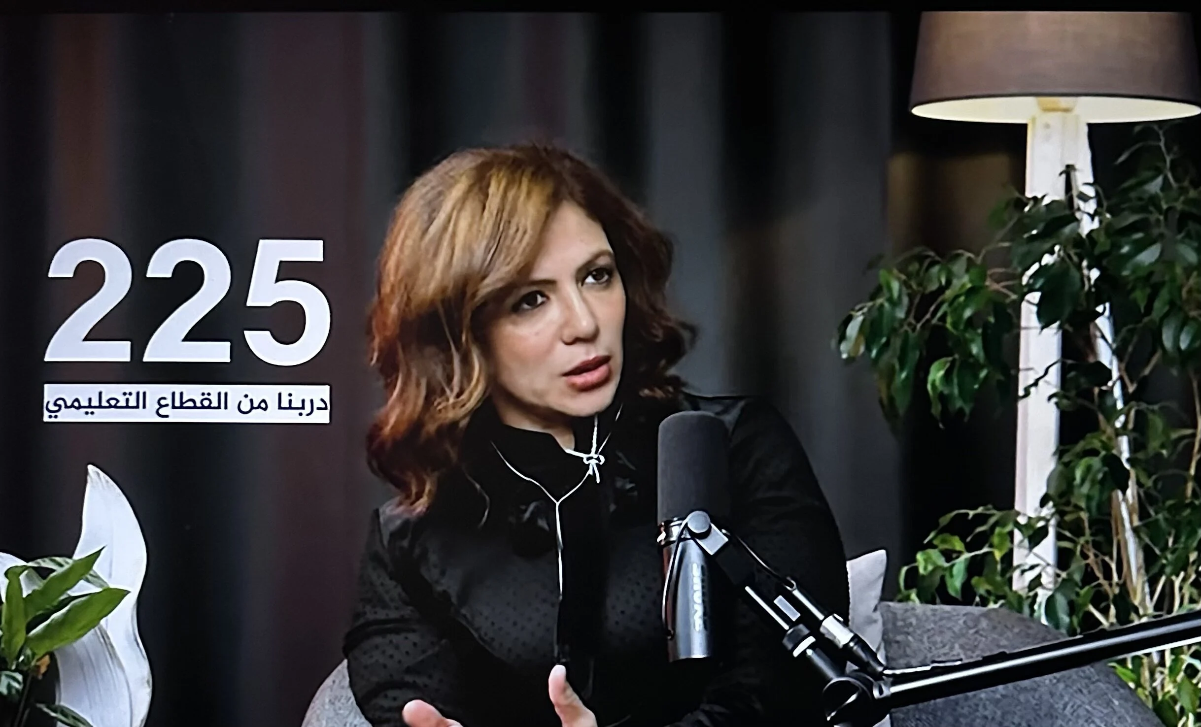 Dr. Mayada Elsabah being interviewed in a TV studio on TEN TV